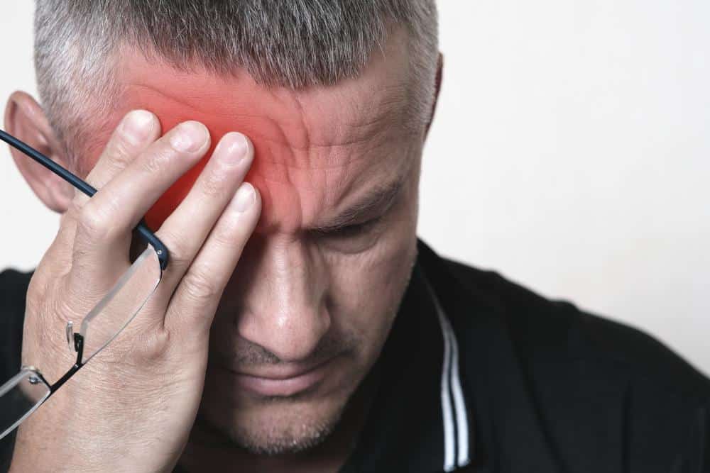 man with migraine.