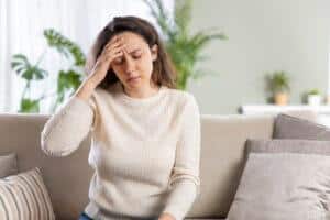 Woman suffering from chronic headaches.