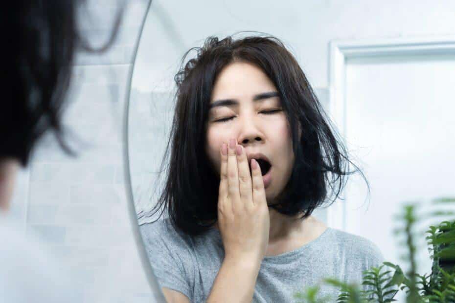 Tired woman yawning